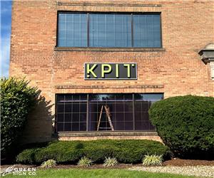 KPIT: Custom Internally Illuminated Channel Letters on Architectural Shoebox